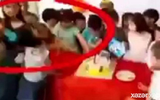 Bağçada uşağın saçını yolan aşpaz cəzalandırıldı - VİDEO