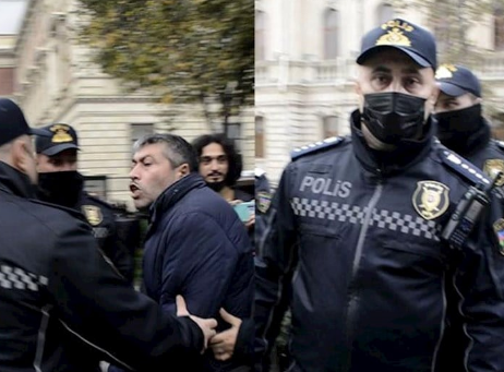 Polislə jurnalist arasında mübahisə: "Başın bədəninə ağırlıq eləməsin" - Video